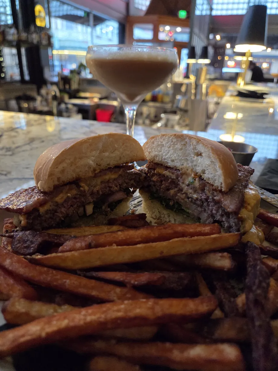 Burger, fries, and a cocktail photographed at Carruthers